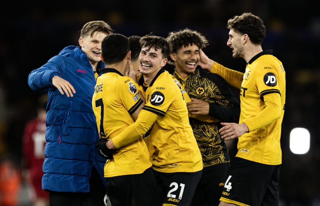 Rodrigo Gomes celebrates with his Wolves teammates.