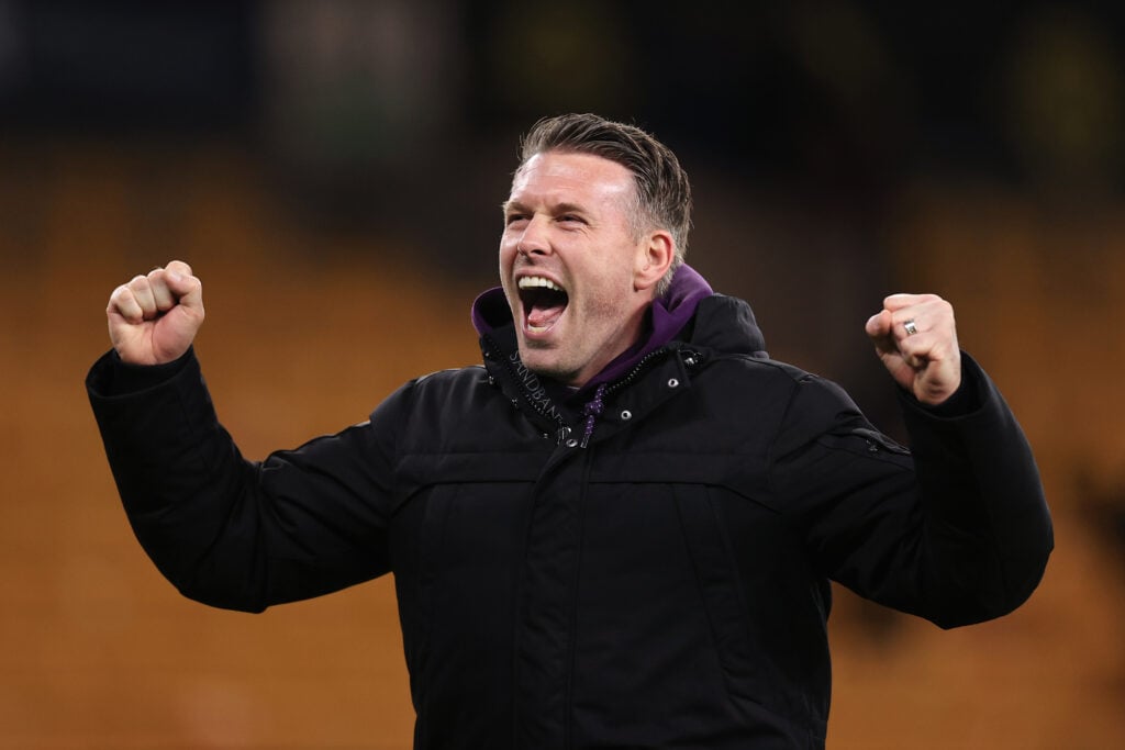 Rob Edwards cheers for Wolves.