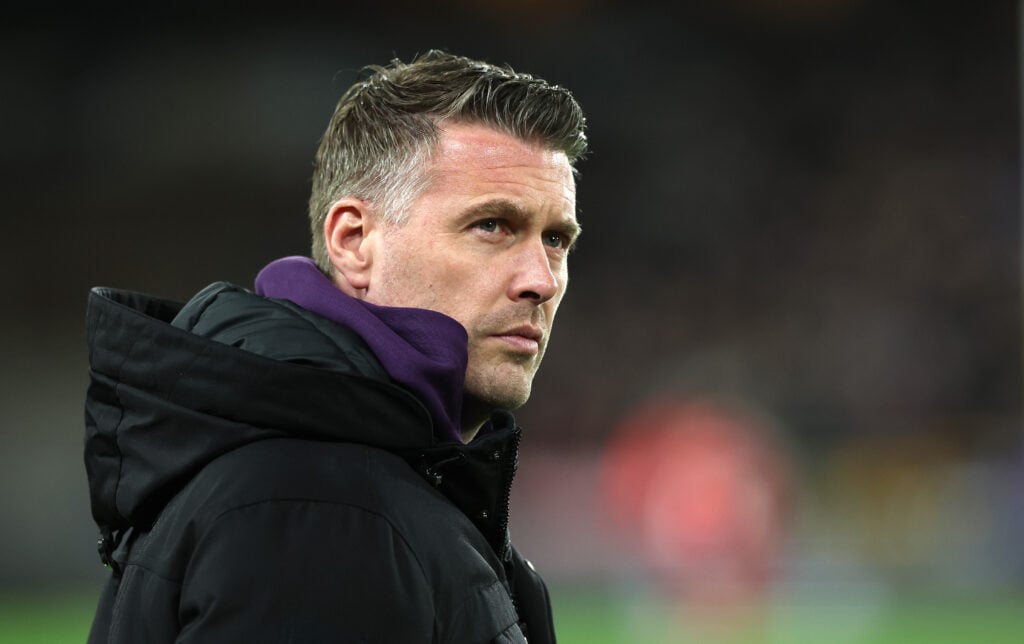 Rob Edwards looks on.