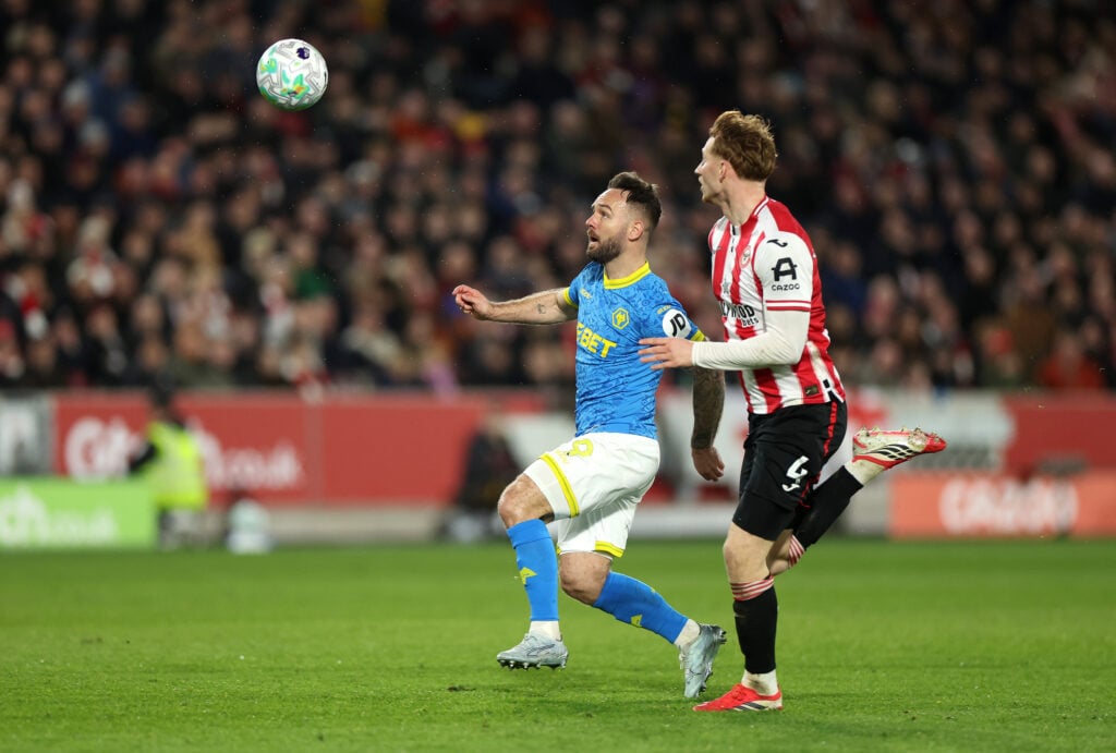 Adam Armstrong looks to control the ball for Wolves.