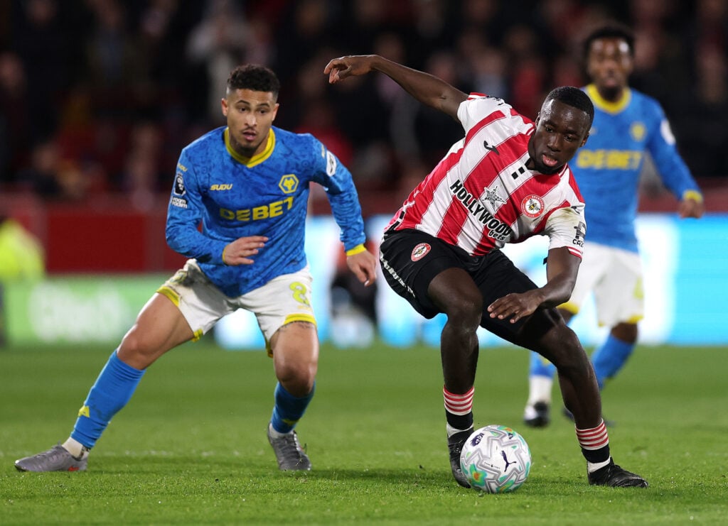 Joao Gomes fights for the ball for Wolves against Brentford.