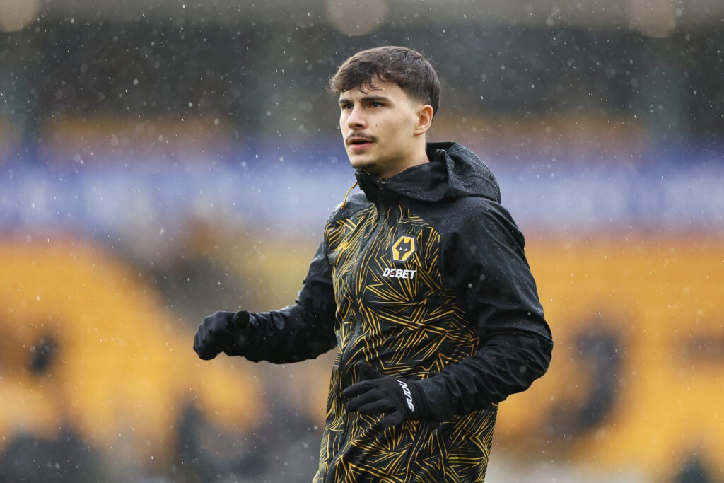 Rodrigo Gomes warming up for Wolves.