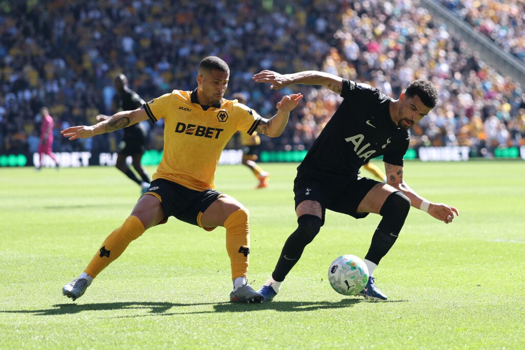 Joao Gomes battles Dominic Solanke for the ball.