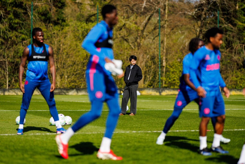 Nathan Shi watches Wolves players train.