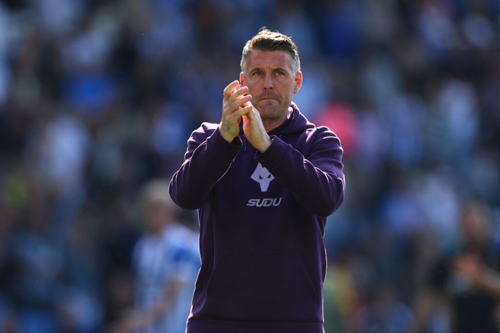 Rob Edwards applauds the fans.