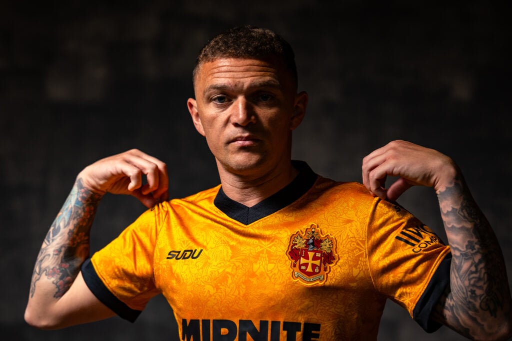 Kieran Trippier poses in a Wolves shirt.