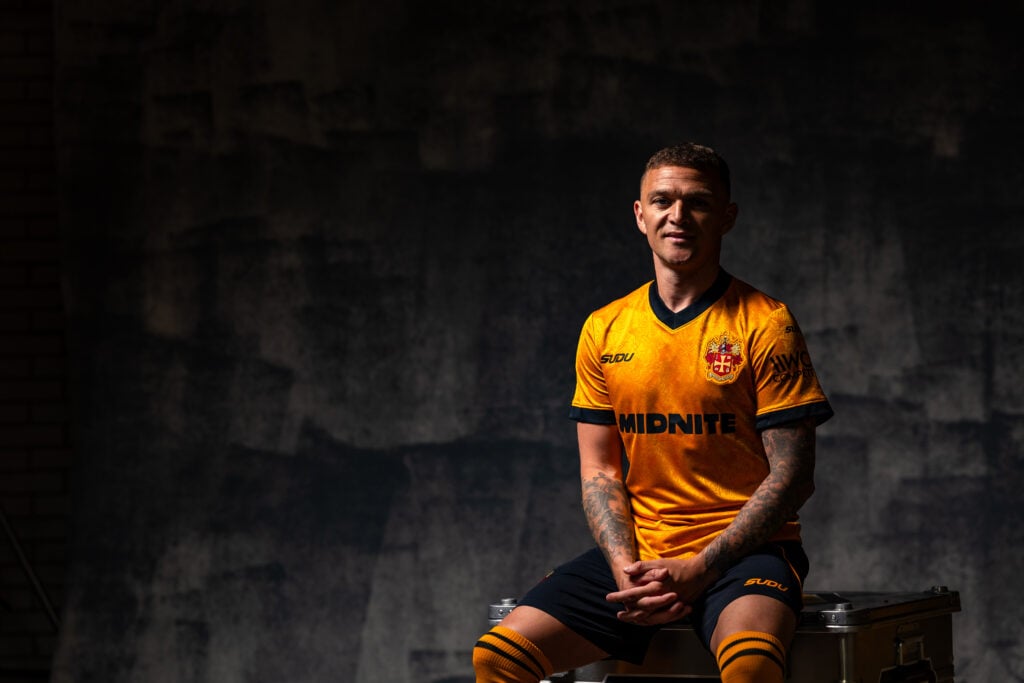 Kieran Trippier poses in a Wolves shirt.