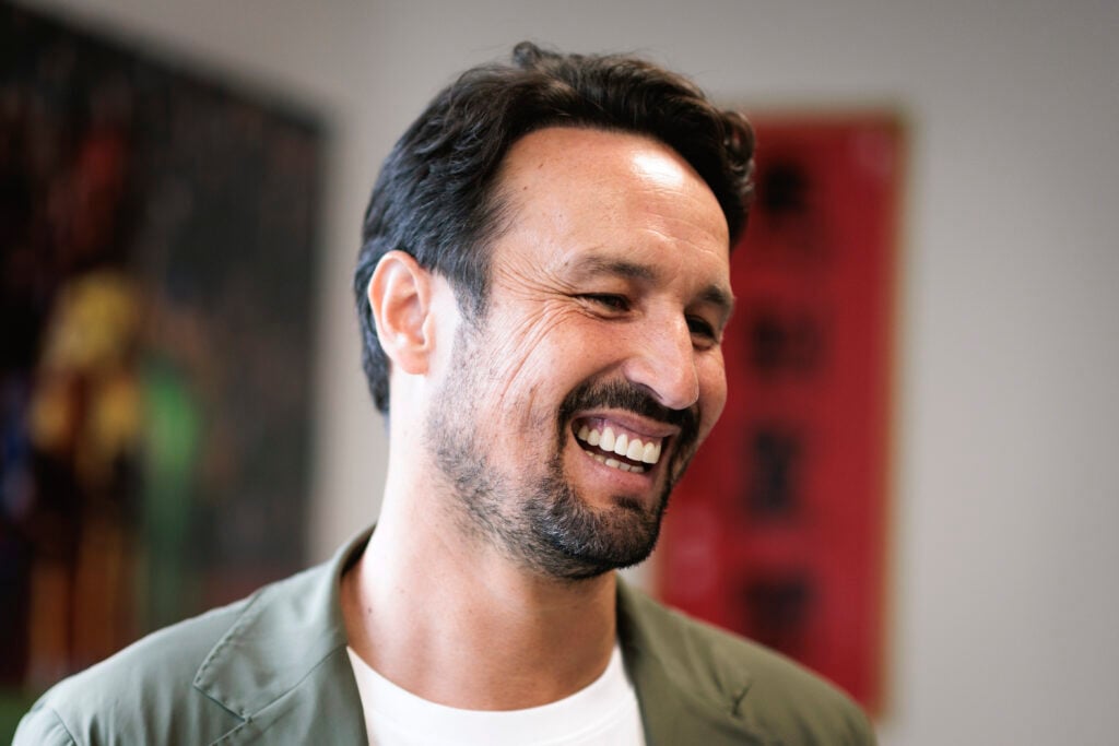 Cesar Peixoto is all smiles.
