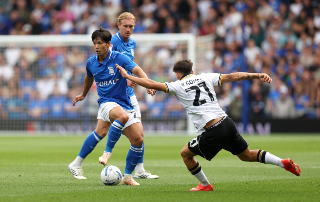 Tomoki Iwata of Birmingham City is challenged by Rodrigo Gomes of Wolverhampton Wanderers during the Sky Bet Championship 2026/27 match between Birmingham City and Wolverhampton Wanderers at St Andrew’s at Knighthead Park on September 06, 2026 in Birmingham, England.